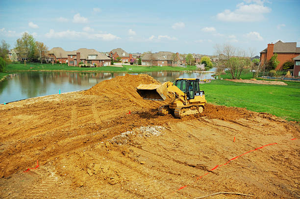 キャタピラーショベルカーだが地下に新規ホテル建設 subdivision - residential home 写真 ストックフォトと画像