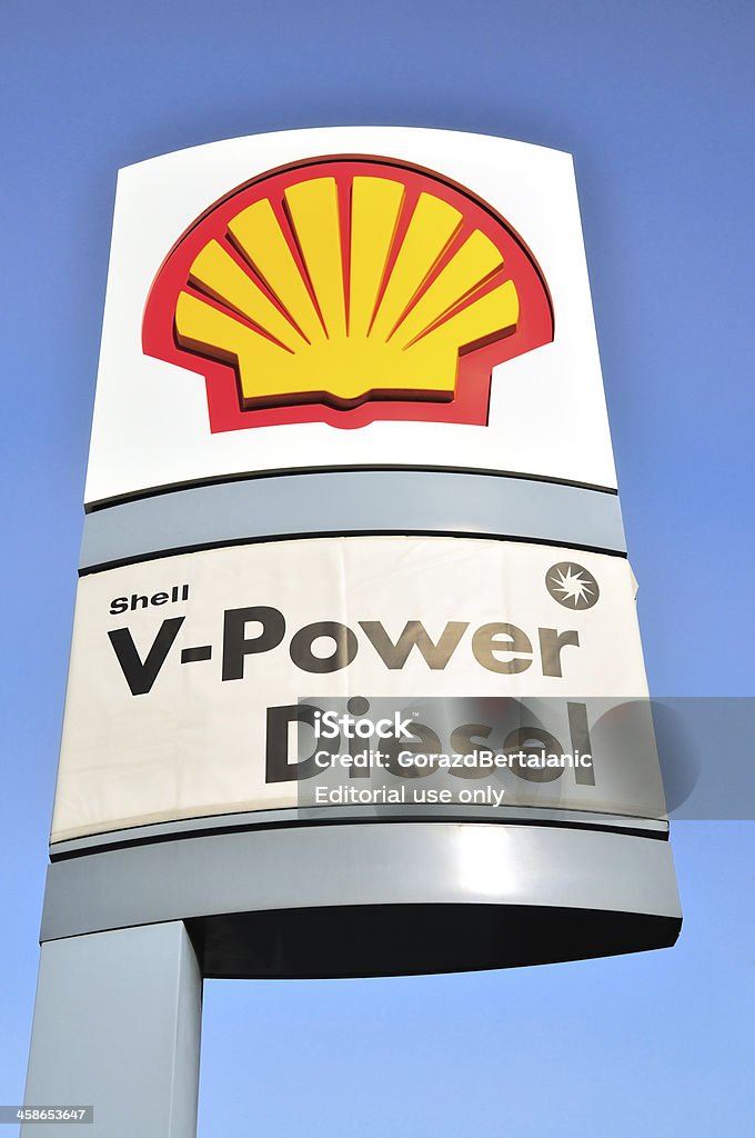 Shell Logo and V-Power Diesel Sign, Prater, Vienna, Austria Vienna, Austria aa April 7, 2011: Logo and advertising sign on a pole against blue sky outside a Shell gas filling station at Prater, Vienna. Shell is a global oil and gas company headquartered in The Hague, Netherlands. It is one of the largest companies in the world. Gas Station Stock Photo