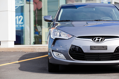 Halifax, Nova Scotia, Canada - September 18, 2011: A Hyundai Veloster on a car dealership lot.  Unveiled in early 2011, the Veloster replaces the defunct Tiburon in Hyundai's line-up.  It contains a 1.6 liter engine producing 138 hp and 123 lb ft of torque.