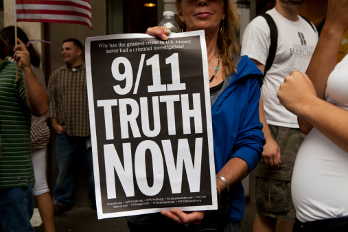 New York, New York, USA - September 11th 2011. Ten years after the terrorist attacks at the Twin Towers, a crowd of people ask for a criminal investigation about september 11th 2001 facts.