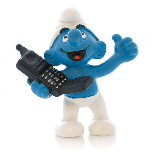 Smurf with mobile phone stock photo