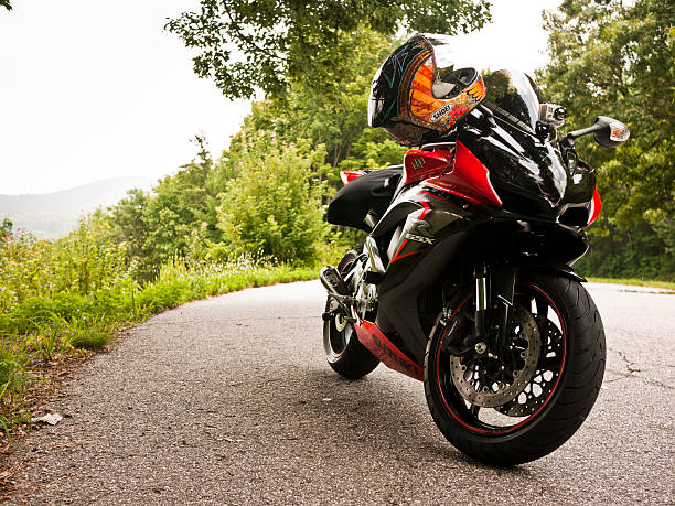 Motorbike speeding up in the city. Panning blurred motion