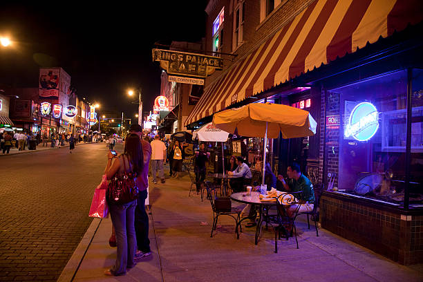 Memphis, Tennessee, USA - 16th October 2010:Tourists and locals out eating, drinking, taking photographs, walking and socialising on historic Beale Street in downtown Memphis.Beale Street is pedestrianised at night; it is known as the \\'Home of the Blues\\'.