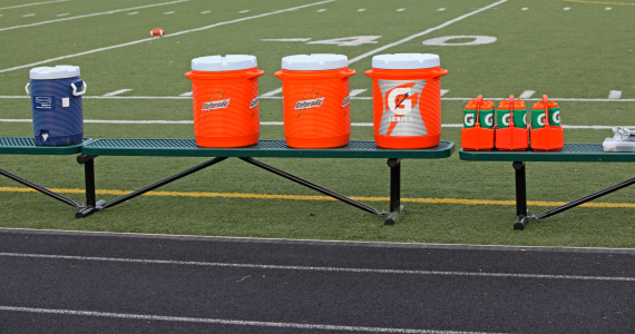 Pittsburgh, Pa, USA - September 02, 2011 : Gatorade is the drink of choice on this  sideline.  Gatorade, a product of PepsiCo, has about 75 percent of the United States sports drink market share.  During the game, players will drink three times more Gatorade than water to replenish their fluids.