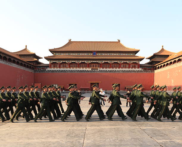 Chinese soldiers Through the forbidden city "beijing,china - April06,2012:Chinese soldiers Singing and Line up Through the forbidden city  South EntranceAEMeridian Gate),Some tourists are photography" communism photos stock pictures, royalty-free photos & images