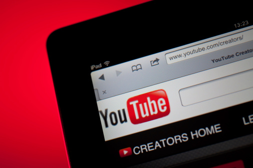 Ankara, Turkey - October 11, 2011:  Close up view of the YouTube home screen.The iPad is produced by Apple Computer, Inc.