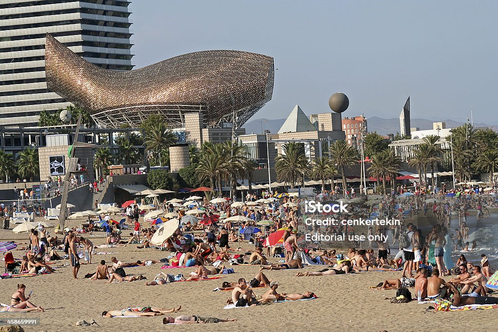 Barcelona Beach "Barcelona, Spain - August 14, 2009: Barceloneta Beach with Frank Gehry's Peix d'Or (Whale Sculpture) on the beach of Barceloneta in Barcelona, Spain." Sculpture Stock Photo