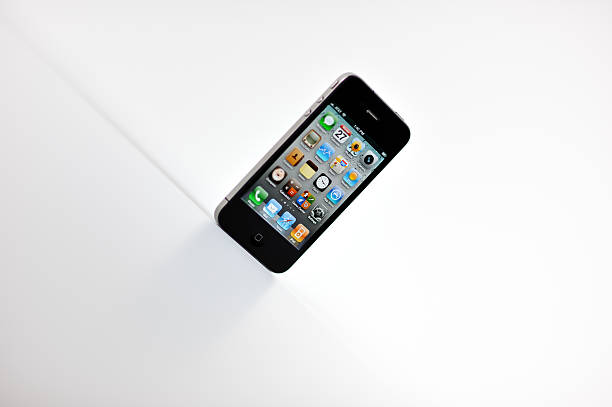 Raleigh, NC - USA - June 27, 2011: Apple iPhone Four Standing on Its End In A Stylized Product Shot.