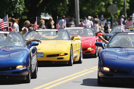 Penfield, New York, USA - July, 4 2008: Members of the Rochester Corvette Club in Rochester, NY drive Chevrolet Corvettes in the Penfield town Independence Day parade.