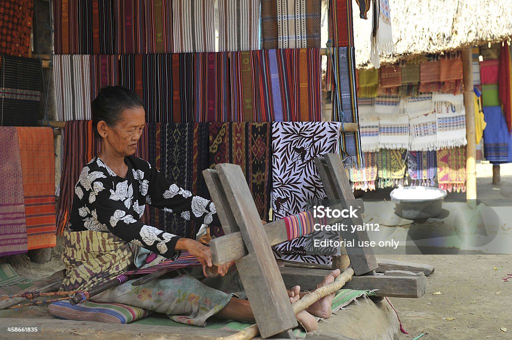 Sasak Lombok, Indonesia - May 15, 2009: Sasak woman is weaving a fabric at Lombok, Indonesia. Indonesia Stock Photo