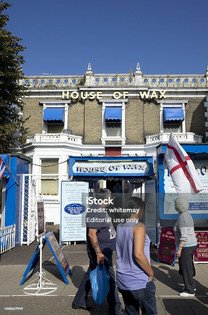 House of Wax, Great Yarmouth Great Yarmouth, England - September 28, 2011: Holiday-makers stroll along Regent Road, Great Yarmouth, outside 'Louis Tussaud's House of Wax' which displays an interesting selection of wax figures and other attractions. Amusement Arcade Stock Photo