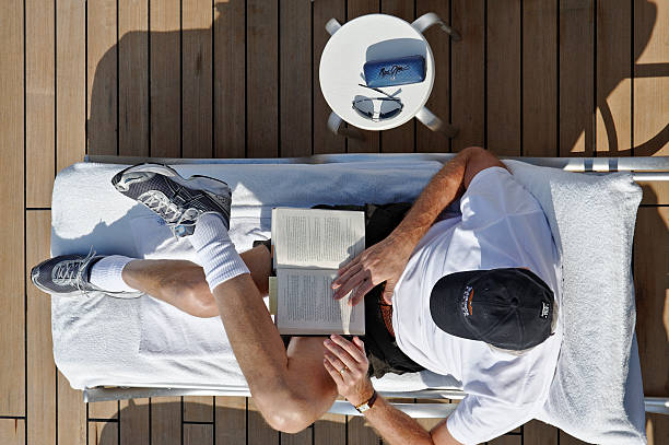 Reading and Relaxing on a Cruise Ship stock photo