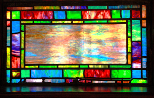 Topeka,Kansas, U.S. - July 7, 2010:  Stained glass window in the First Presbyterian Church of Topeka, Kansas. Windows were installed in 1911 and were commissioned by Mrs. Josephine Brooks to honor her husband Jonathan Brooks. The glass is a unique glass called favrile which was invented by Louise Comfort Tiffany.