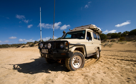 Coffin Bay, Australia - December 9, 2009: An off-road vehicle traversing the sandy tracks of Coffin Bay National Park in South Australia.