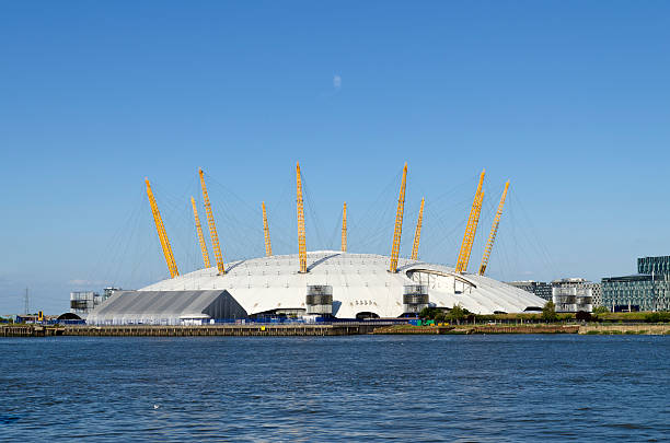 London, United Kingdom - July 24, 2011: Millennium Dome, Greenwich Peninsula, London. View across the Thames of the Millennium Dome located in South East London. Originally constructed as a venue and focal point for the London millennium celebrations, it is now known as the O2 Arena and contains, bars, restaurants, a cinema, nightclub and indoor arena.