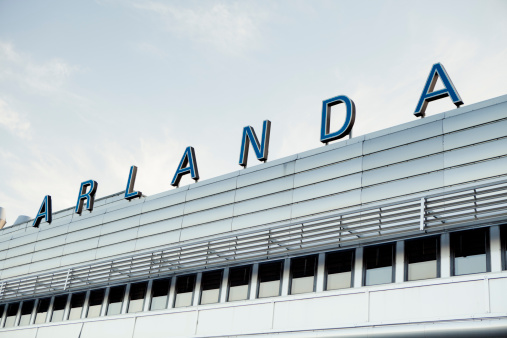Arlanda, Sweden - June 28, 2011: Building exterior and Arlanda sign. Stockholm Arlanda International Airport is Swedens biggest international airport. This is a photo of Terminal 5, which is the the biggest terminal with international flights and three separate peers.