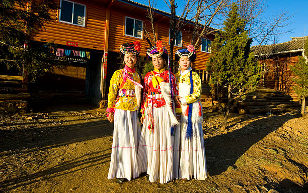 The portrait of Mosuo tribe girls in traditional costume stock photo