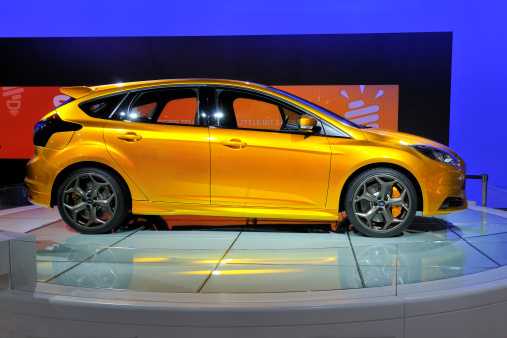 Amsterdam, The Netherlands - April 12, 2011:  Golden Ford Focus ST conceptcar on display at the 2011 Amsterdam AutoRAI motorshow. The 2011 Amsterdam motorshow was running from April 12 until April 23, in the RAI event center in Amsterdam, The Netherlands.