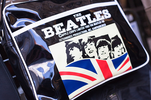 London, England - May 2, 2011: a bag with The Beatles sign and Union Jack is on sale in a shop located in Camden Town in London.