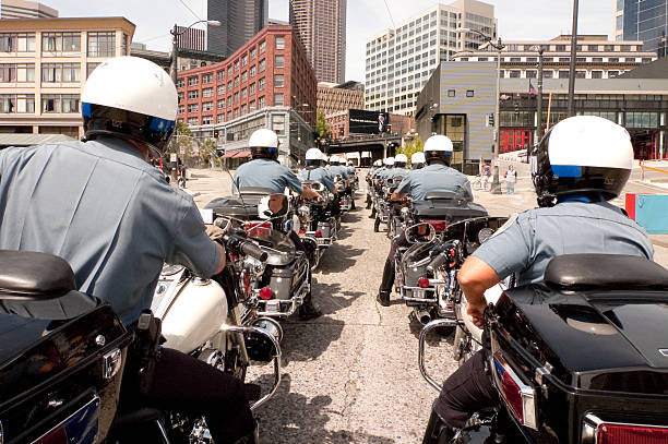 Seattle, USA - May 29th 2009: Seattle Police Officers Motorcycle Unit Directing Traffic on 4th ave during a Health care Protest. 