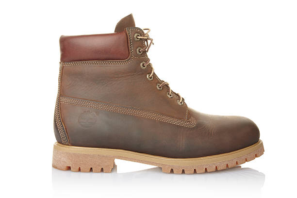 Timberland Boot "Milan, Italy - October 27, 2010: Side view of Timberland brand brown leather boot." timberland arizona stock pictures, royalty-free photos & images