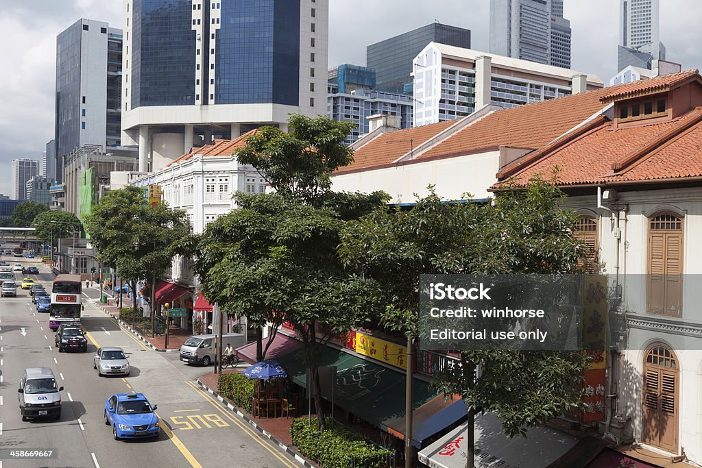 China Town in Singapore Singapore City, Singapore - May 19, 2012 : People at the shopping street in China Town. China Town is also known as Niu Che Shui in Chinese. Many Chinese teashops and restaurants are located in China Town. It is a tourist attraction in Singapore. Asia Stock Photo