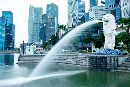 Singapore City, Singapore - October 4th, 2011: Merlion park is in the central business district of Singapore. It is a popular tourist attraction over looking the Marina Bay towrds the Sand Htel and the ArtScience Museum.
