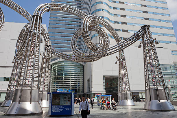 Yokohama, Japan - September 29, 2010 : Pedestrians walk past the road outside the Queen\\'s Square Yokohama. It is located in Minato Mirai, Nishi, Yokohama, Japan. Queen\\'s Square Yokohama is a major commercial complex with shopping mall, restaurants and a variety of fashion stores.