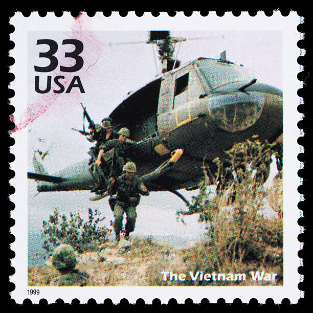 Sacramento, California, USA - March 20, 2011: A 1999 USA postage stamp with a photo of soldiers disembarking from a military helicopter near Chu Lai in 1967 during the Vietnam War (1954-1975). The stamp was designed by Carl Herrman and the photo was taken by Howard C. Breedlove.