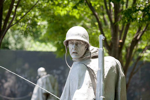 Washington DC, USA - May 2, 2015: Tourists and War Veterans and guardians of Honor Flight nonprofit organization in Korean War Veterans Memorial in West Potomac Park, National Mall.