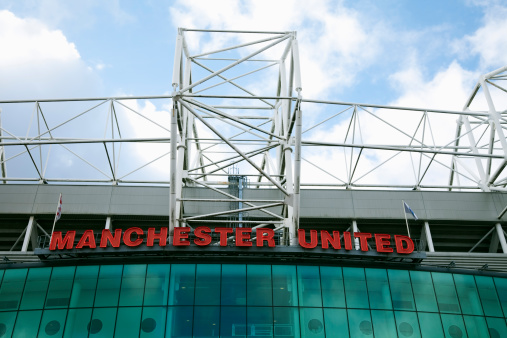 Manchester, UK - February 26, 2011: Old Trafford football stadium, the famous home of Manchester United, one of the most recognised global brands in sport.