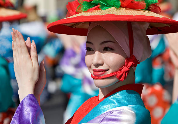 Japanese woman wearing bright kimono dance in a parade stock photo