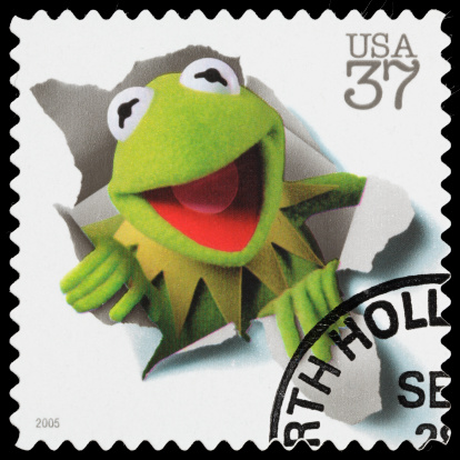 Sacramento, California, USA - April 16, 2012: A 2005 USA postage stamp with an image of  Kermit the Frog, one of the Muppets from the TV series 'The Muppet Show'. Kermit is one of the oldest and best-known Muppet characters, and is commonly identified with the song (and saying) It's Not Easy Being Green.