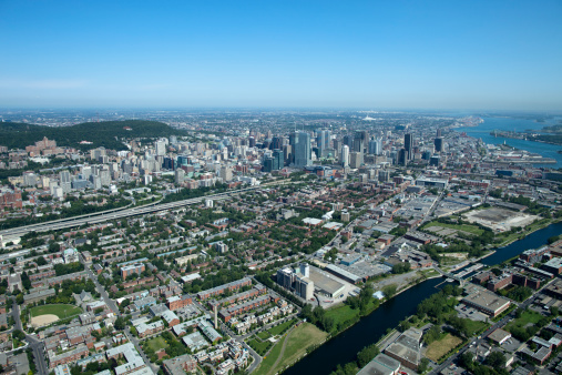 Montreal, Canada - August 19, 2010: Aerial of Montreal taking from a helicopter in Summer. This photograph shows, Mt-Royal in the background as well as the downtown core and the St-Lawrence river.