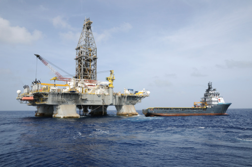Gulf of Mexico, USA - July 31, 2009: TransOcean's oil rig &amp;amp;amp;amp;amp;amp;amp;amp;quot;Deepwater Horizon&amp;amp;amp;amp;amp;amp;amp;amp;quot;. The supply vessel &amp;amp;amp;amp;amp;amp;amp;amp;quot;Damon B Bankston&amp;amp;amp;amp;amp;amp;amp;amp;quot; operated by Tidewater is next to it. The rig made a record oil discovery for BP at the Tiber Prospect, GOM in 2009. The rig suffered a blow out while drilling at the Macondo Prospect in April 2010, then caught fire and sank  killing 11 and creating the worst oil spill ever in the Gulf of Mexico.