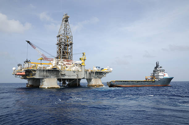 "Deepwater Horizon" offshore oil rig and Tidewater supply vessel stock photo