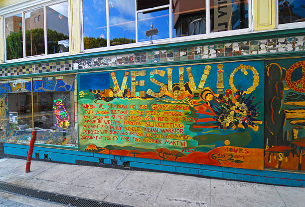 Beautiful Brazilian girl spray painting a mural on the side of a building