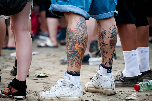 Budapest, Hungary - August 15, 2010: Group of people assisting to a concert during the afternoon in the main stage area of the Sziget Festival. The Sziget is one of the most important music and arts festival in the world. It takes place every august in Obuda island, close to Budapest.
