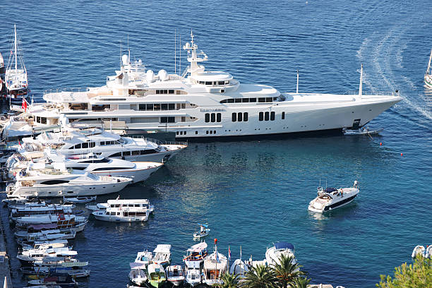 Hvar, Croatia - August 6, 2011: Ecstasea Yacht among other yachts docked at Hvar harbour. 86 meter Ecstasea yacht was ordered by Russian oligarch Roman Abramovich from Feadship. It was later sold to unknown Egyptian for $200 million. Photographed from elevated location.