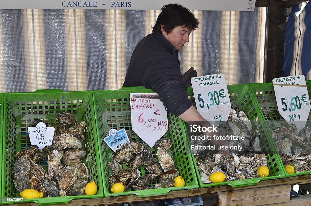 France, Brittany "Cancale, France - June 10th 2011: oyster sale on a street market in the village of Cancale in Brittany" Oyster Bed Stock Photo