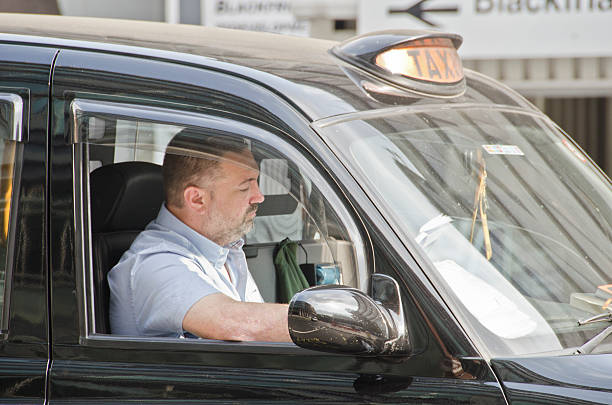 london taxi driver - black cab stock-fotos und bilder