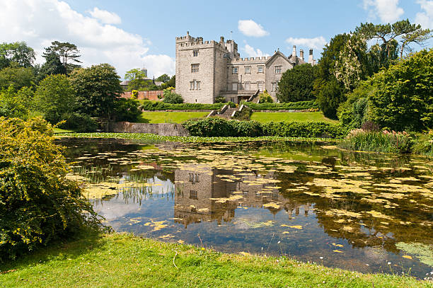 Sizergh Castle near Kendal "Kendal,England - 14th July, 2011: Sizergh Castle, near Kendal in the English Lake District Cumbria, on a sunny afternoon with the castle reflected in a lake." national trust photos stock pictures, royalty-free photos & images