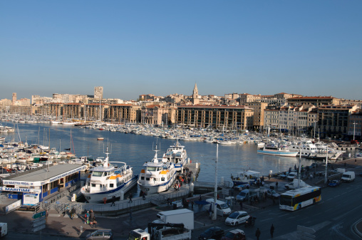 Marseille, France - April 13, 2010: Vieux Port Marina, located at the end of the CanebiAre, so named for the production of hemp for ropes. This area has been the natural harbour of Marseille since 600BC and is now a tourist attraction full of pleasure boats and the ferries which sail to the Islands and Calanques.