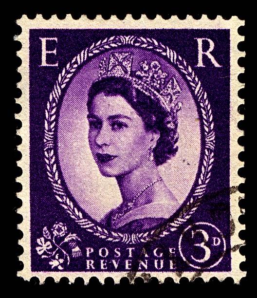 Postage stamp. "Gomel, Belarus - March 2, 2012: Postage stamp. A stamp printed in United Kingdom shows image of Elizabeth II (Elizabeth Alexandra Mary) is the constitutional monarch of United Kingdom in purple, circa 1952." elizabeth ii photos stock pictures, royalty-free photos & images