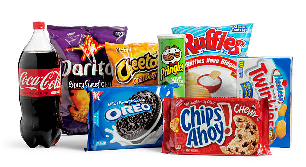 Junk Food San Diego, California, United States - April 21st 2011: This is a photo taken in the studio on a white background of a variety of unhealthy foods. Ready to eat convenience food that is regular consumed can lead to obesity and health problems. convenience food stock pictures, royalty-free photos & images