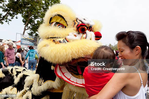 Woman And Child Are Greeted By A Dragon Stock Photo - Download Image Now - Adult, Arts Culture and Entertainment, Asian Culture