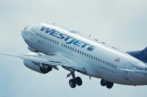 Goffs, Nova Scotia, Canada - April 15, 2006: A Westjet flight takes off from Halifax International Airport.  WestJet Airlines Ltd. is a Canadian low-cost carrier that provides scheduled and charter air service to 71 destinations in Canada, the United States, Mexico and the Caribbean.