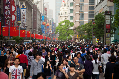 Shanghai, China - May, 1 2011: Chinese tourists walking on Nanjing Street during the Chinese May 1st holiday, Shanghai, China. Nanjing Road, Shanghai's most famous shopping street