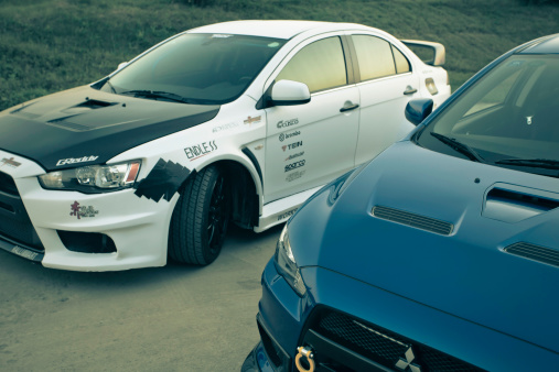 chengdu,china-September 29,2011:two customized mitsubishi lancer evolution X(EVO) parked on the chengdu jingang sports track with nobody when the sun goes down