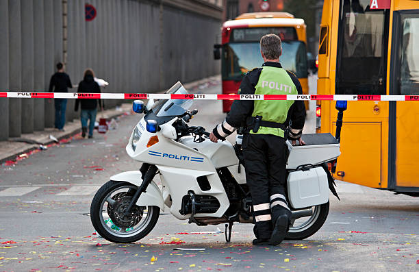 Motorcycle cop controlling traffic stock photo